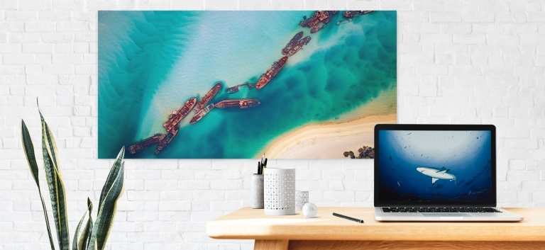Canvas Print hanging on a wall and an image on a computer to be downloaded